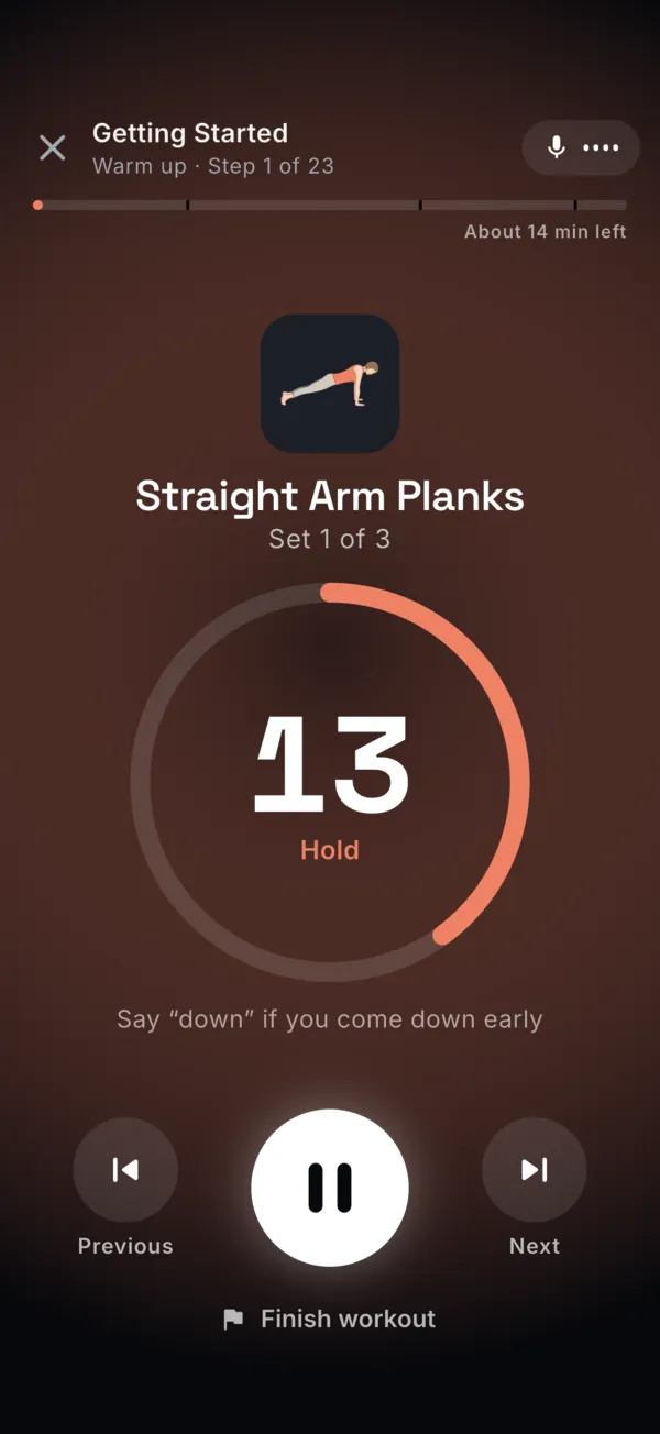 The hands-free workout player during Straight Arm Planks: a 13 second hold on the clock, with the hint Say “down” if you come down early.